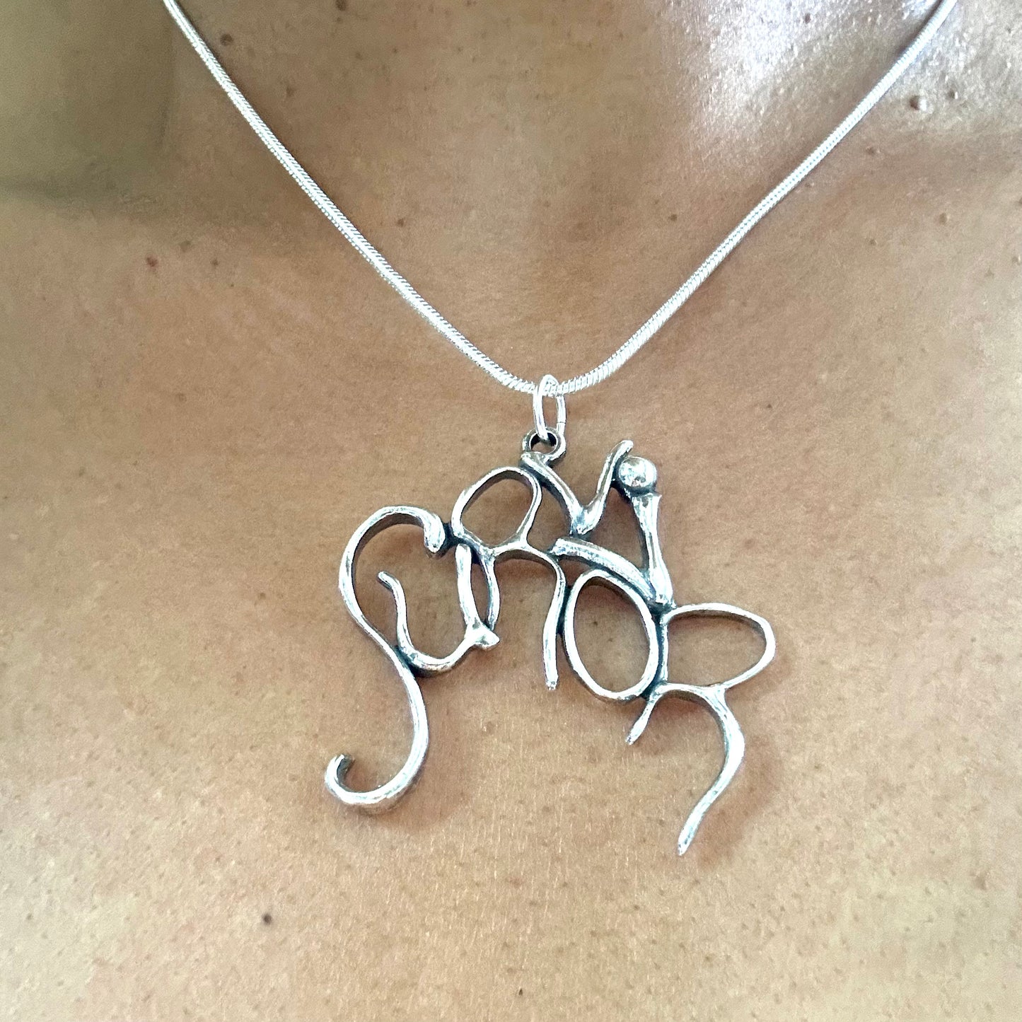 Survivor- Sterling Silver with Leather